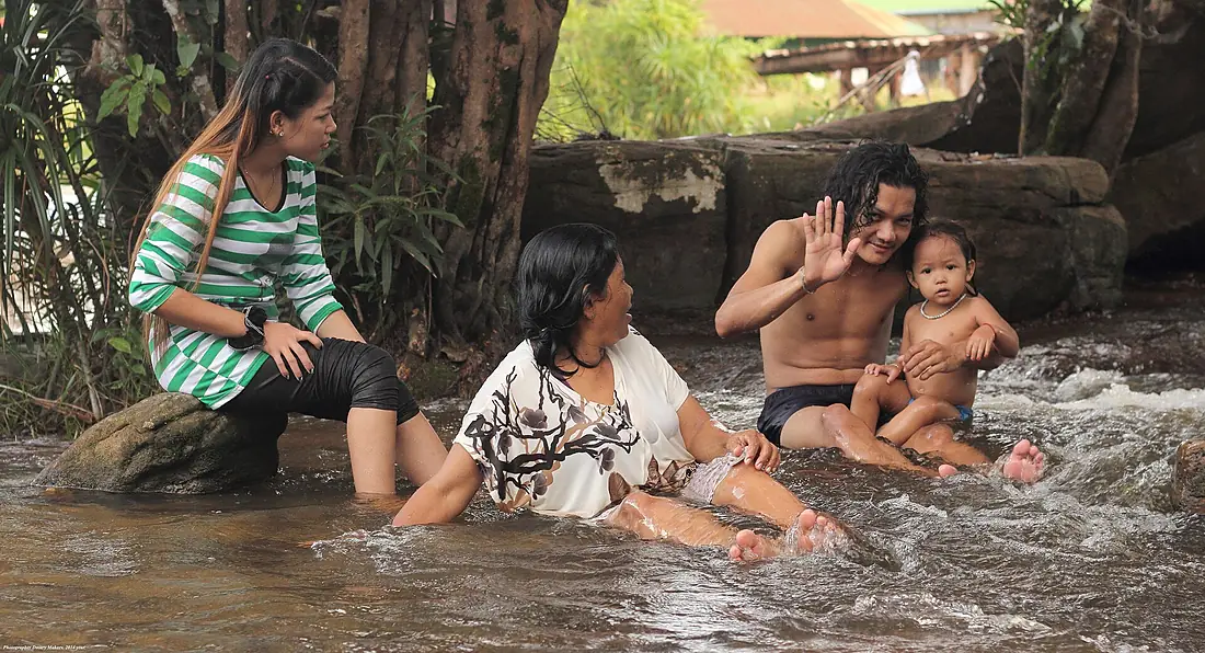 Cambodia. Bathing in the waters of the waterfall Kbal Chhay