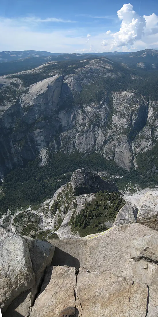 Half Dome view. Vertical panorama, looking straight down near the northeast corner of Half Dome (elev 8836) and then across Tenaya Canyon. The mound below is Ahwiyah Point (elev ~6950), on the center right is Snow Creek - panoramio